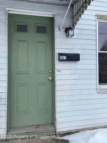 a view of a kitchen with a sink and dishwasher wooden floor