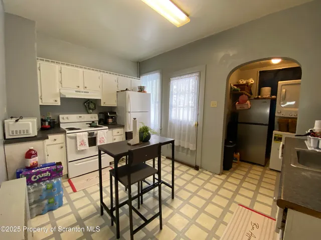 a bedroom with a bed and a desk