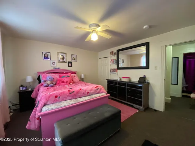 a bathroom with a toilet and shower