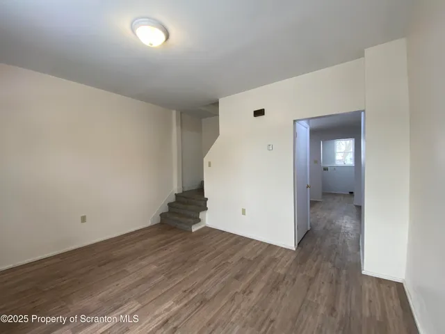a bathroom with a toilet a sink and bathtub