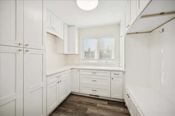 a view of cabinets and window