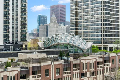 a living room with furniture and a book shelf