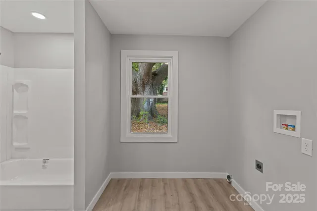 a bathroom with a bathtub and shower