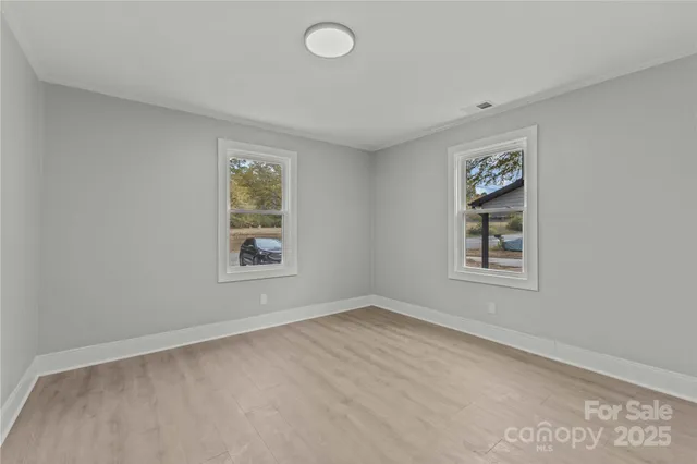 an empty room with windows