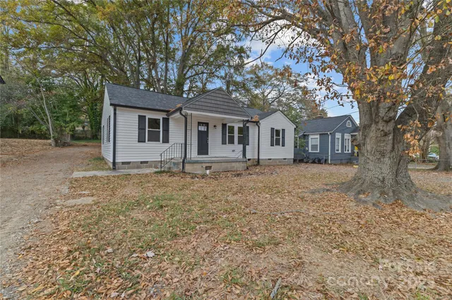 front view of a house with a trees