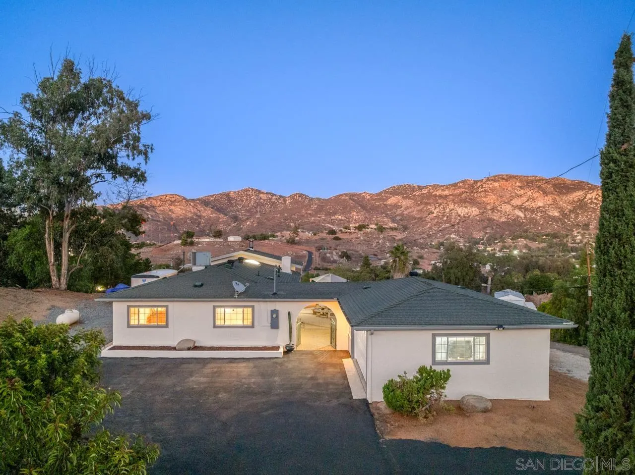 an aerial view of residential houses and trees around