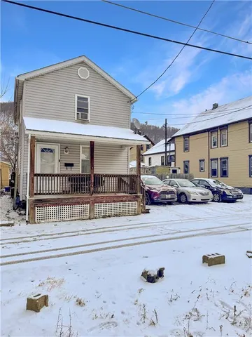 a view of a brick house with many windows