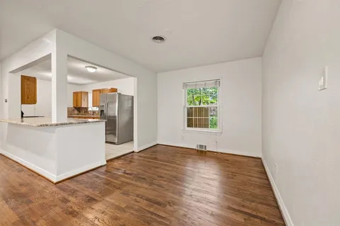 a view of kitchen with furniture and wooden floor