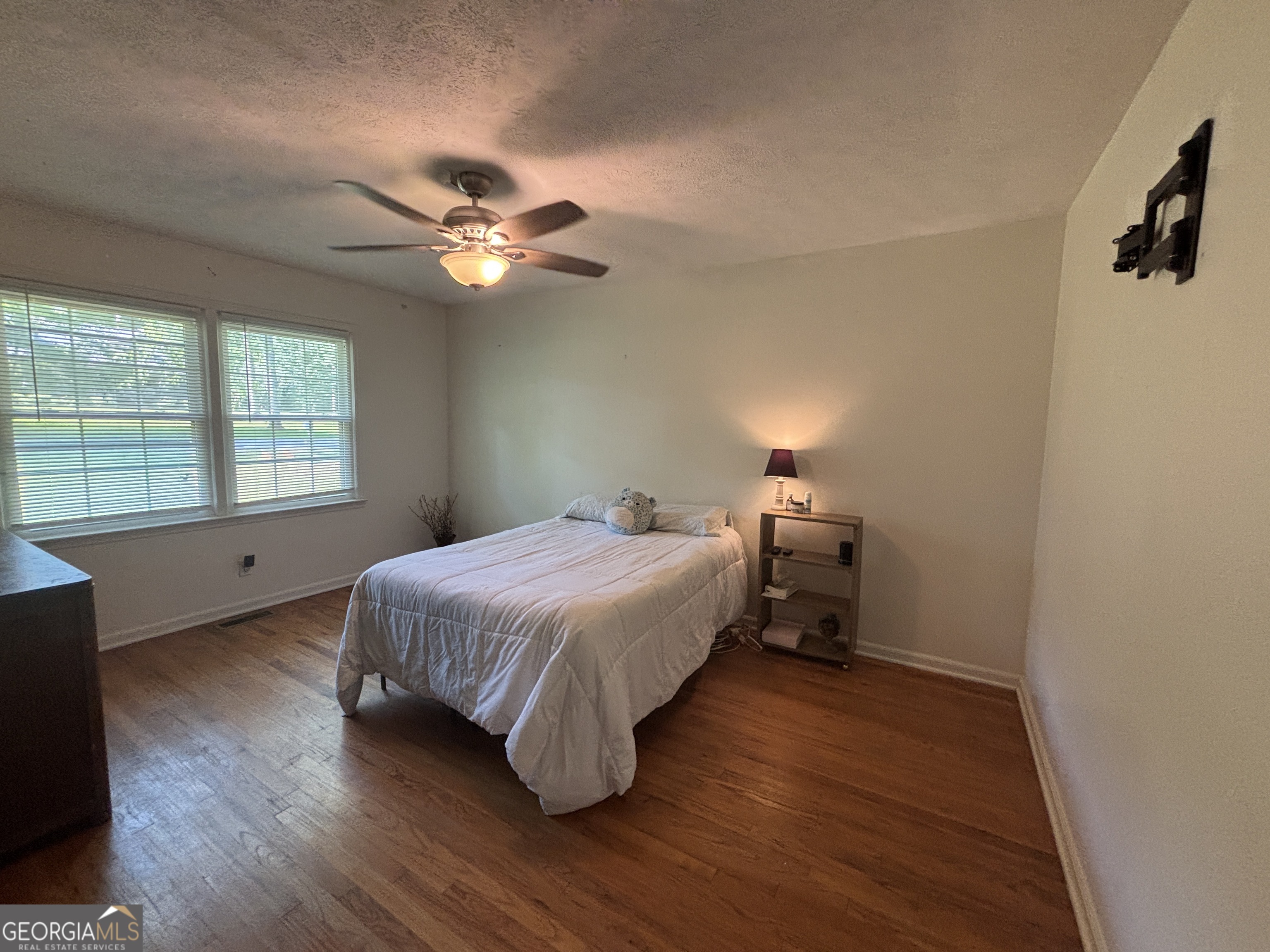 152 Crest Drive Cochran, GA 31014 - Photo 26 of 54 a bedroom with a bed and a chandelier