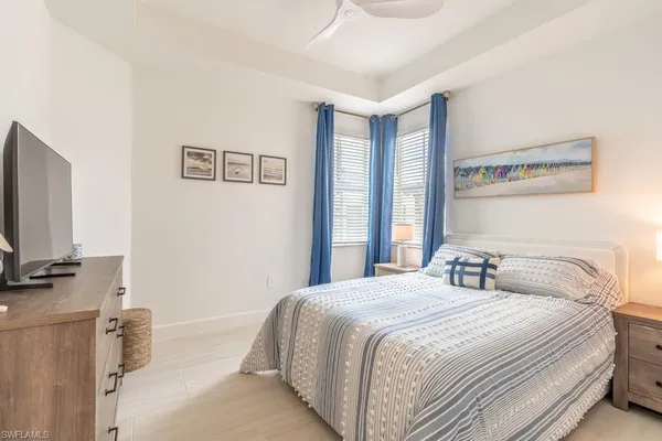 a bathroom with a sink toilet vanity and shower