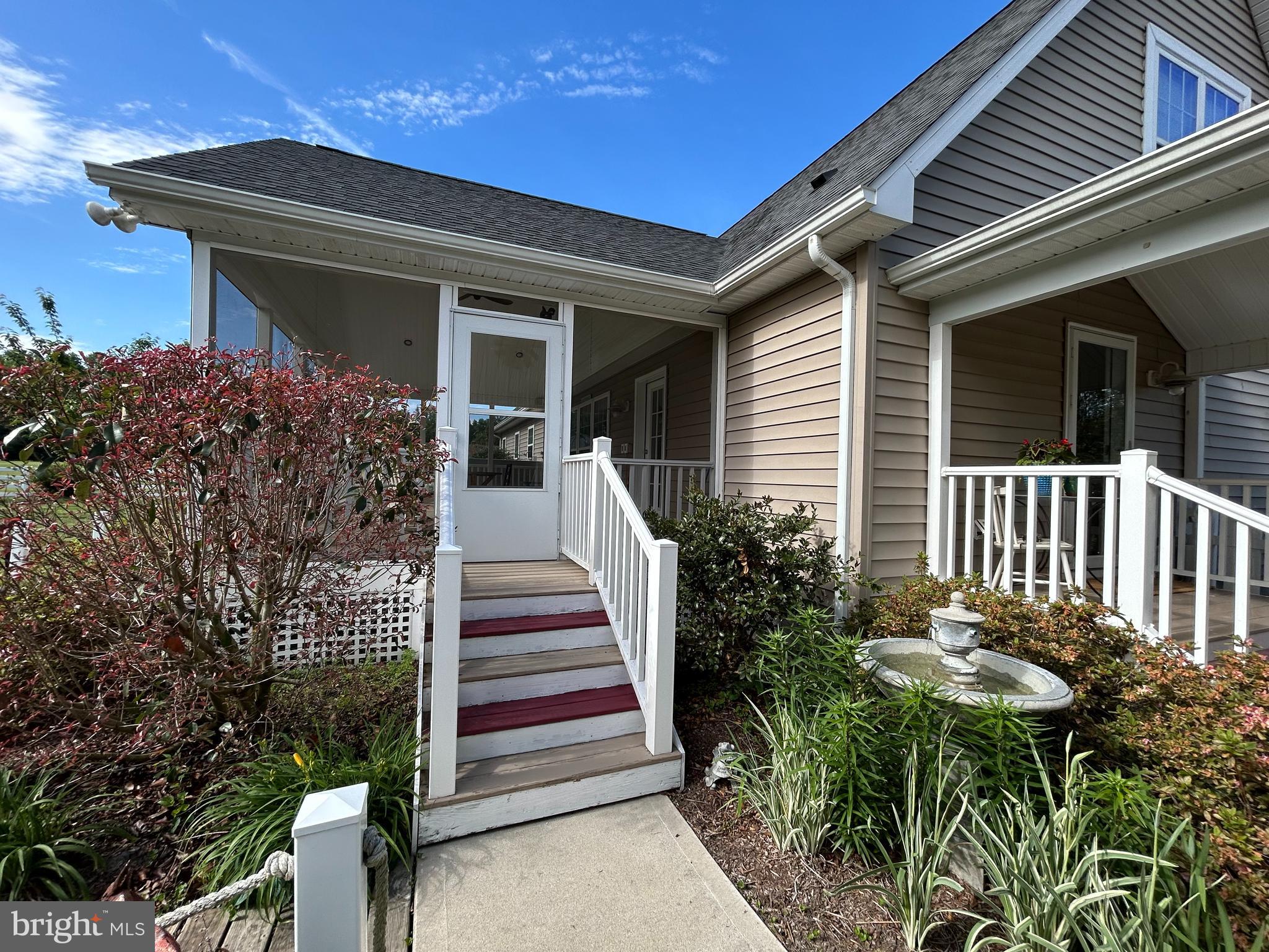 20346 Cool Spring Road Milton, DE 19968 - Photo 15 of 67 a front view of a house with a porch