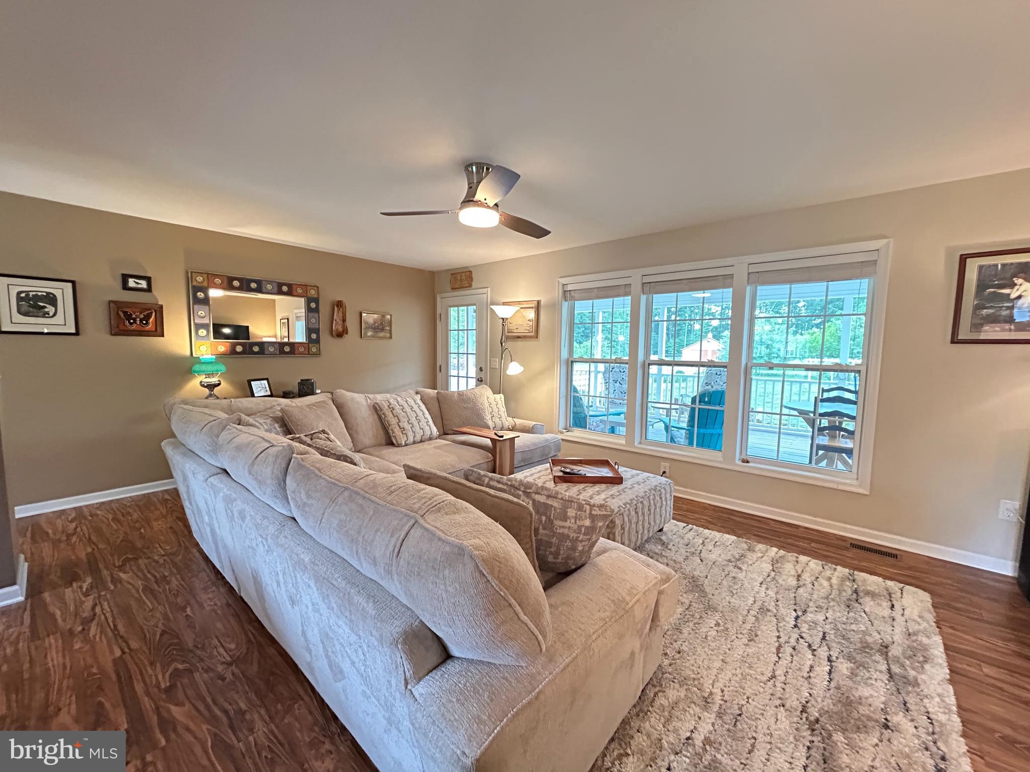 20346 Cool Spring Road Milton, DE 19968 - Photo 20 of 67 a living room with furniture and a large window