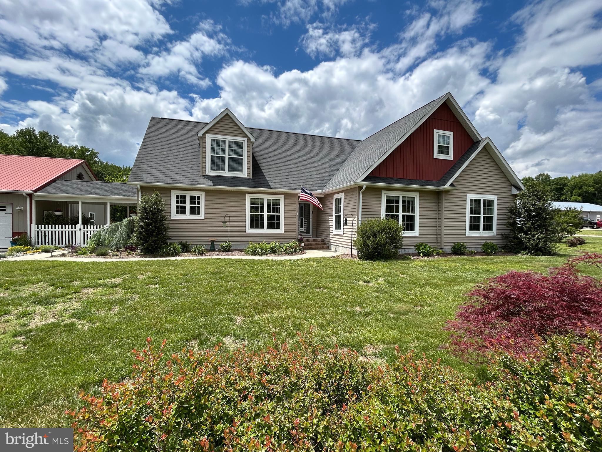 20346 Cool Spring Road Milton, DE 19968 - Photo 2 of 67 a front view of a house with a garden