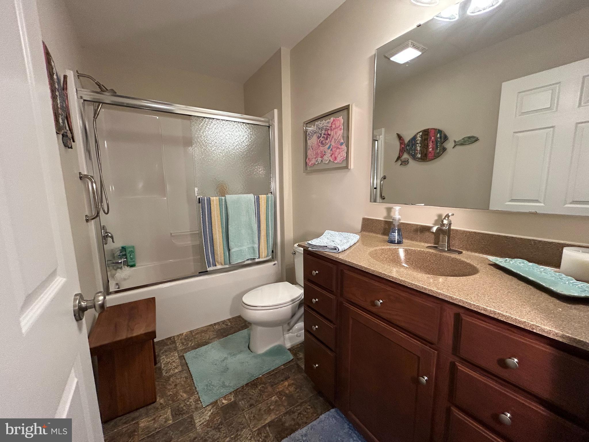 20346 Cool Spring Road Milton, DE 19968 - Photo 48 of 67 a bathroom with a sink a toilet and shower