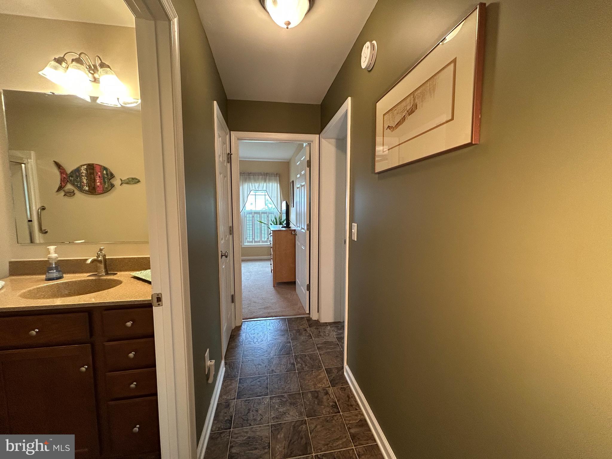 20346 Cool Spring Road Milton, DE 19968 - Photo 50 of 67 a bathroom with a sink and a mirror