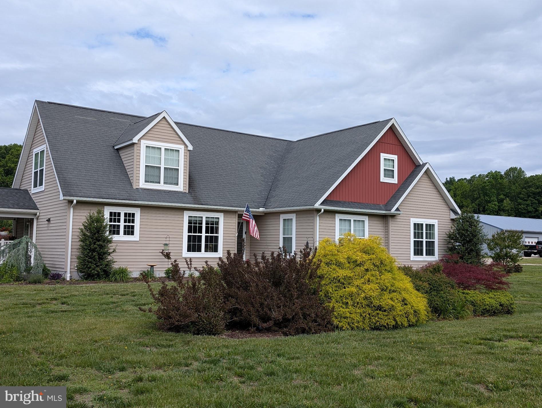 20346 Cool Spring Road Milton, DE 19968 - Photo 65 of 67 a front view of a house with a garden