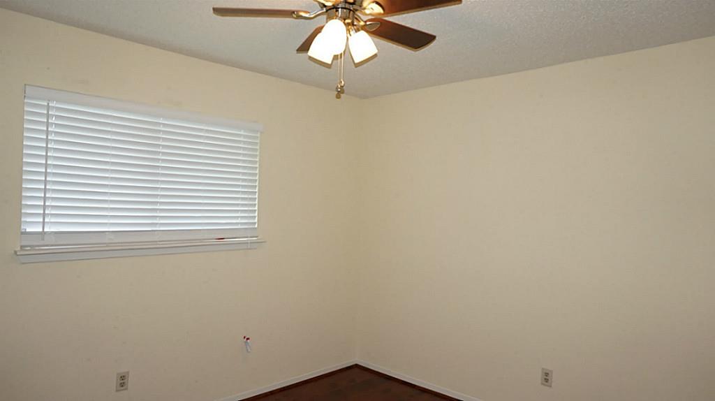 9219 Carousel Lane Houston, TX 77080 - Photo 28 of 31 2nd Bed, new ceiling fan, new wood blinds, new laminate floor.