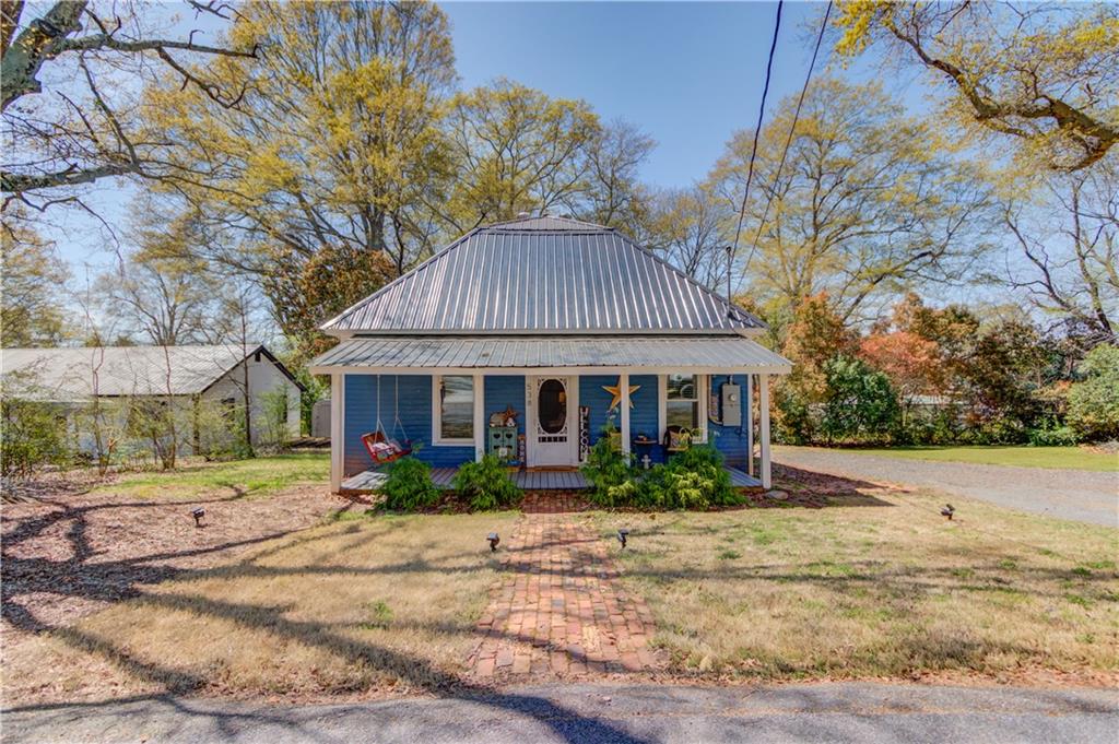 538 Spring Street Commerce, GA 30529 - Photo 1 of 1 a front view of house with yard and green space