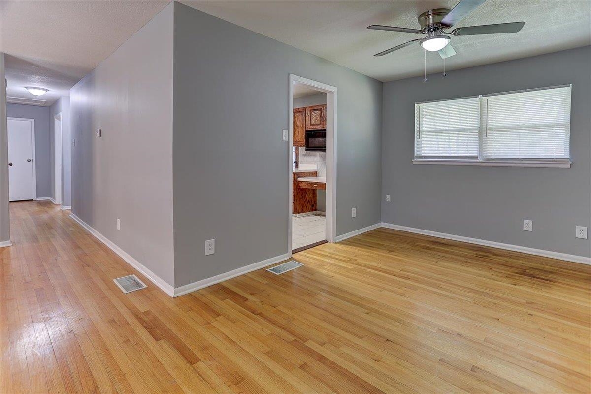 3263 Glen Logan Road Memphis, TN 38134 - Photo 14 of 40 a view of empty room with wooden floor