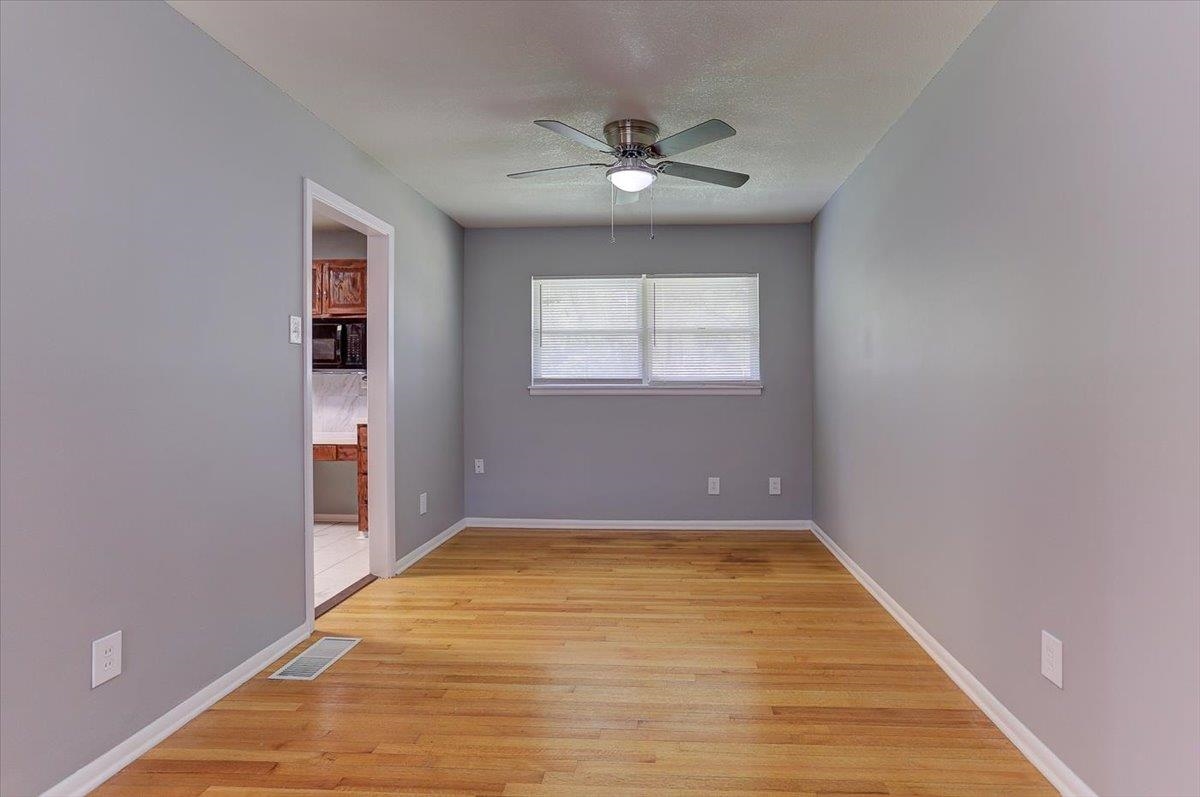 3263 Glen Logan Road Memphis, TN 38134 - Photo 15 of 40 a view of an empty room with a chandelier fan