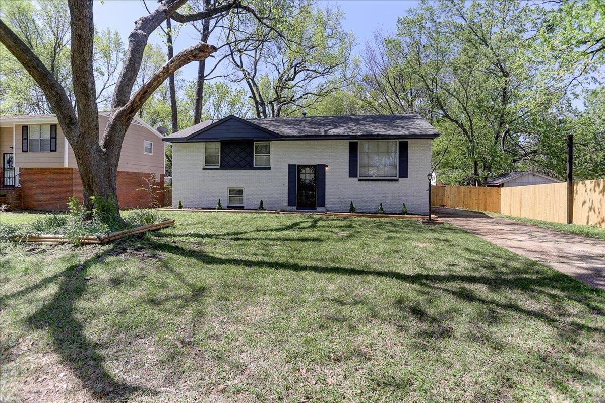 3263 Glen Logan Road Memphis, TN 38134 - Photo 2 of 40 a house that has a tree in front of it