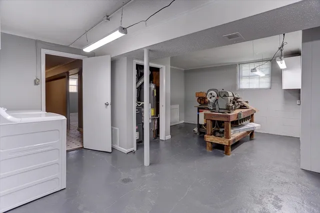 a view of storage and utility room with washer and dryer