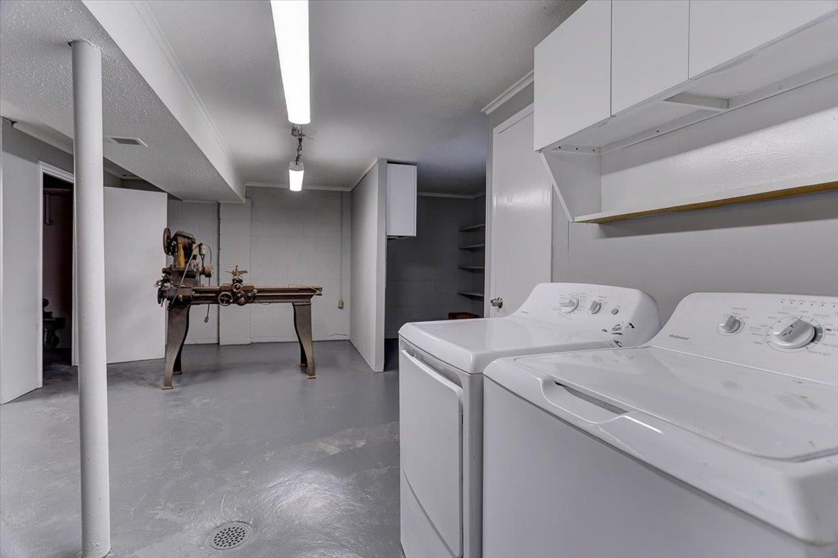 3263 Glen Logan Road Memphis, TN 38134 - Photo 31 of 40 a view of storage and utility room with washer and dryer