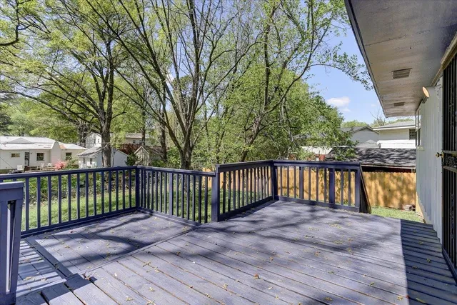 a view of backyard with deck and wooden floor