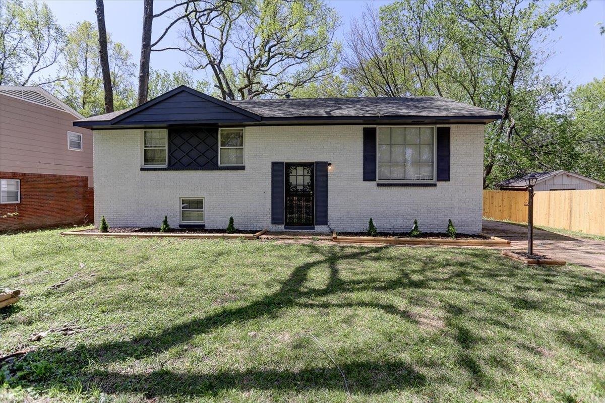 3263 Glen Logan Road Memphis, TN 38134 - Photo 4 of 40 a house with green field in front of it