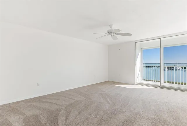 a bathroom with a double vanity sink large mirror and a bathtub
