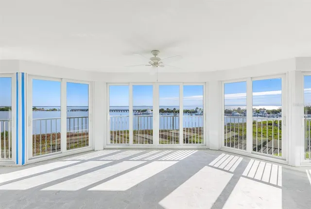 a kitchen with a sink a stove cabinets and white stainless steel appliances