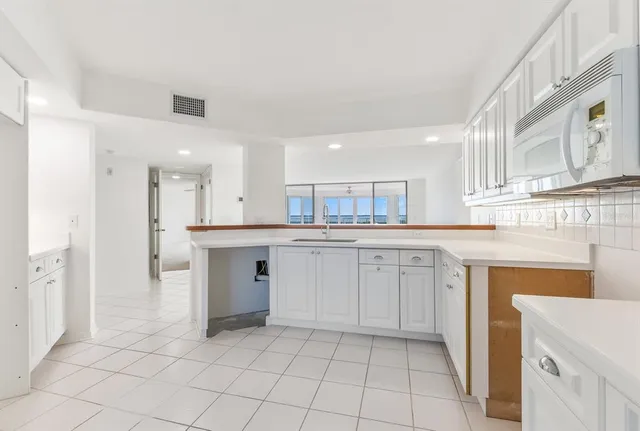 a bathroom with a sink a mirror and a bathtub