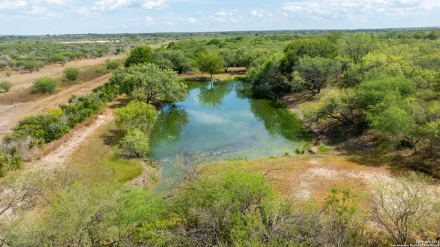 a view of a lake with a yard