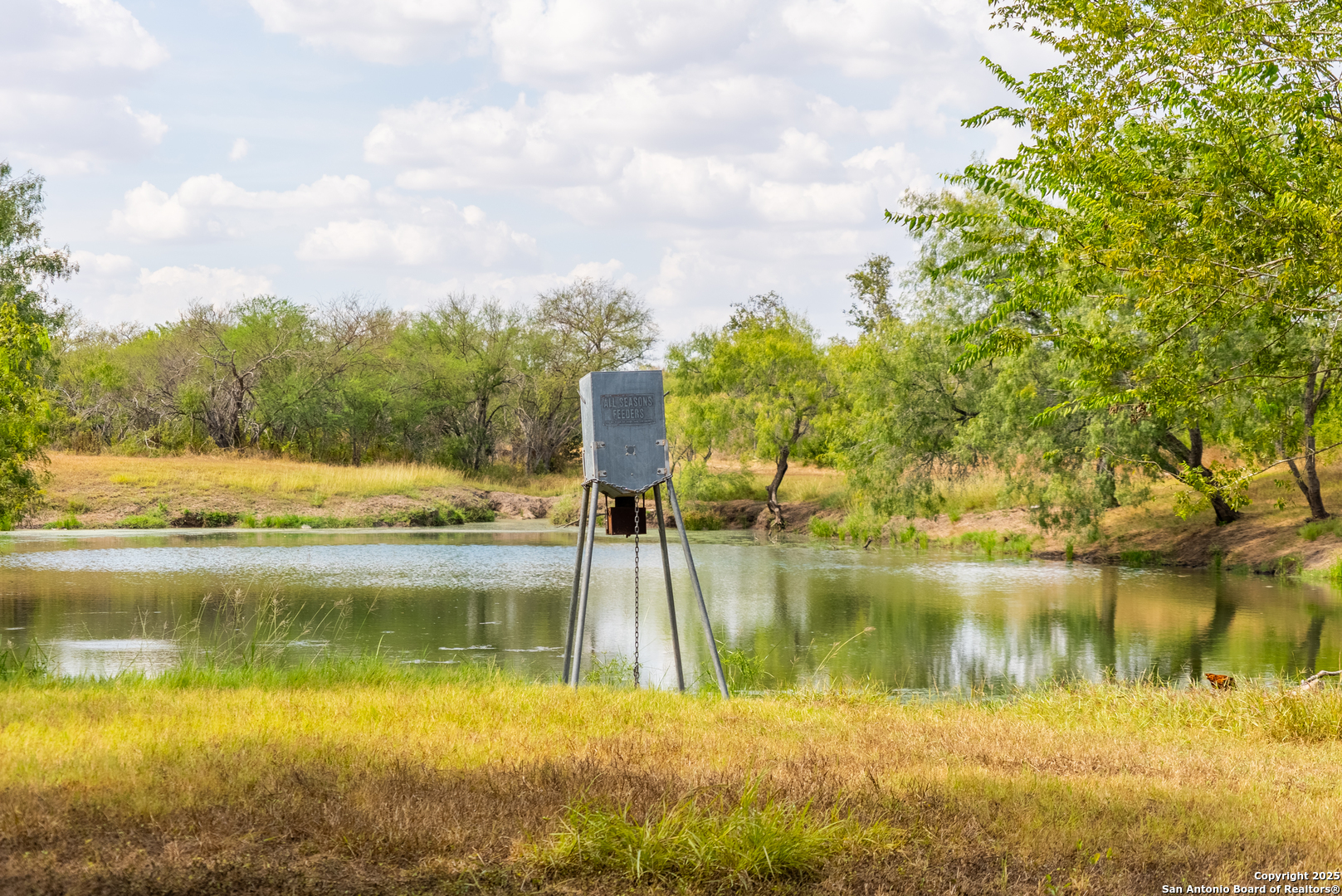 0 County Road 332 Runge, TX 78151 - Photo 12 of 44 a view of a lake with houses in the back