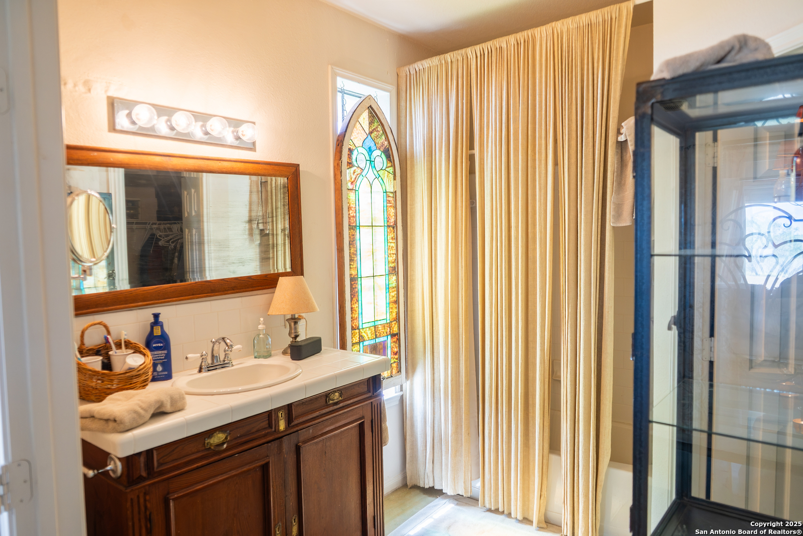0 County Road 332 Runge, TX 78151 - Photo 24 of 44 a bathroom with a sink a mirror and a window
