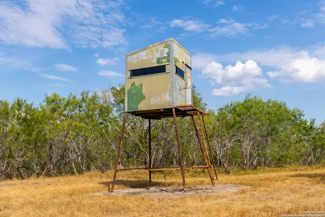 a view of a lake with a yard