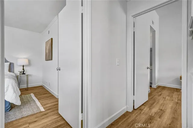 a view of a room with wooden floor