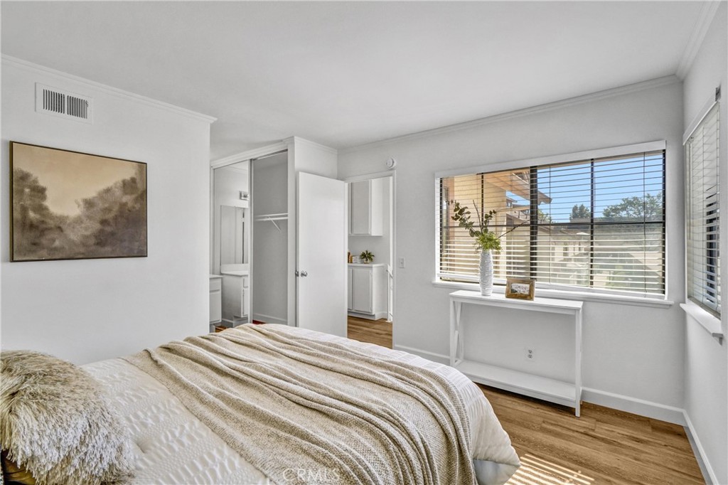 3110 Cochise Way, Unit 91 Fullerton, CA 92833 - Photo 16 of 25 a bedroom with a bed and a large window