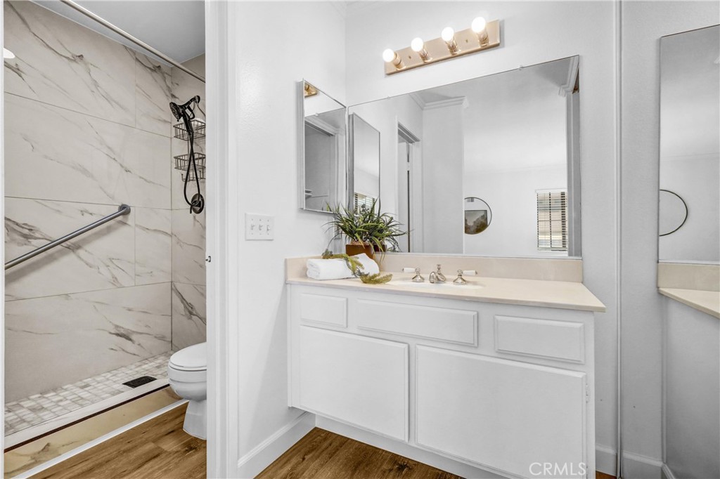 3110 Cochise Way, Unit 91 Fullerton, CA 92833 - Photo 17 of 25 a bathroom with a sink and mirror