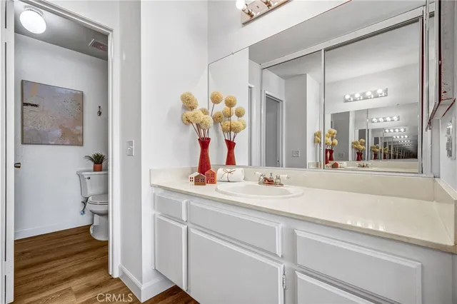 a bathroom with a sink a vanity and a mirror