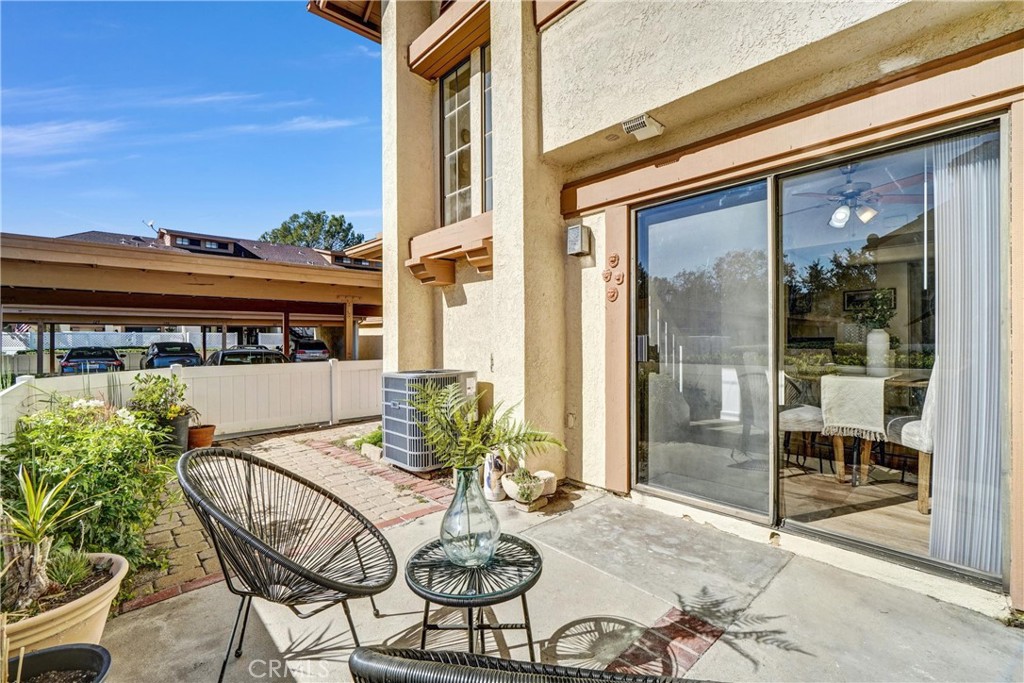 3110 Cochise Way, Unit 91 Fullerton, CA 92833 - Photo 24 of 25 a view of a patio with table and chairs and potted plants