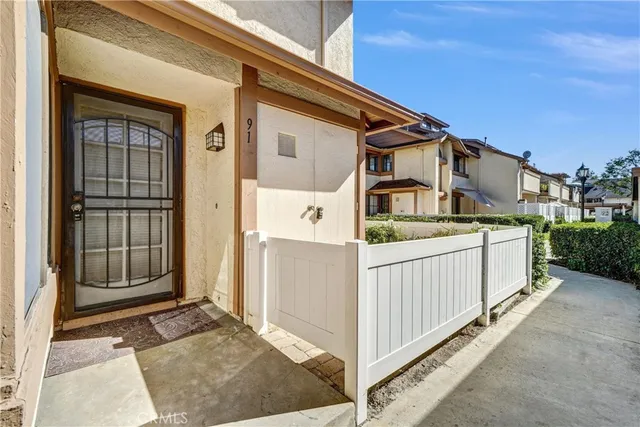 a view of a house with entrance gate