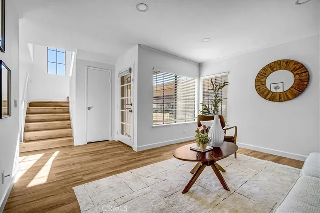 a view of a livingroom with furniture and lounge chair