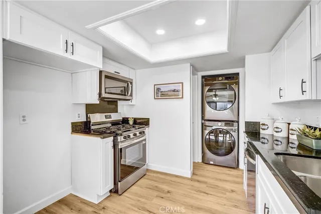a kitchen with a stove and a refrigerator
