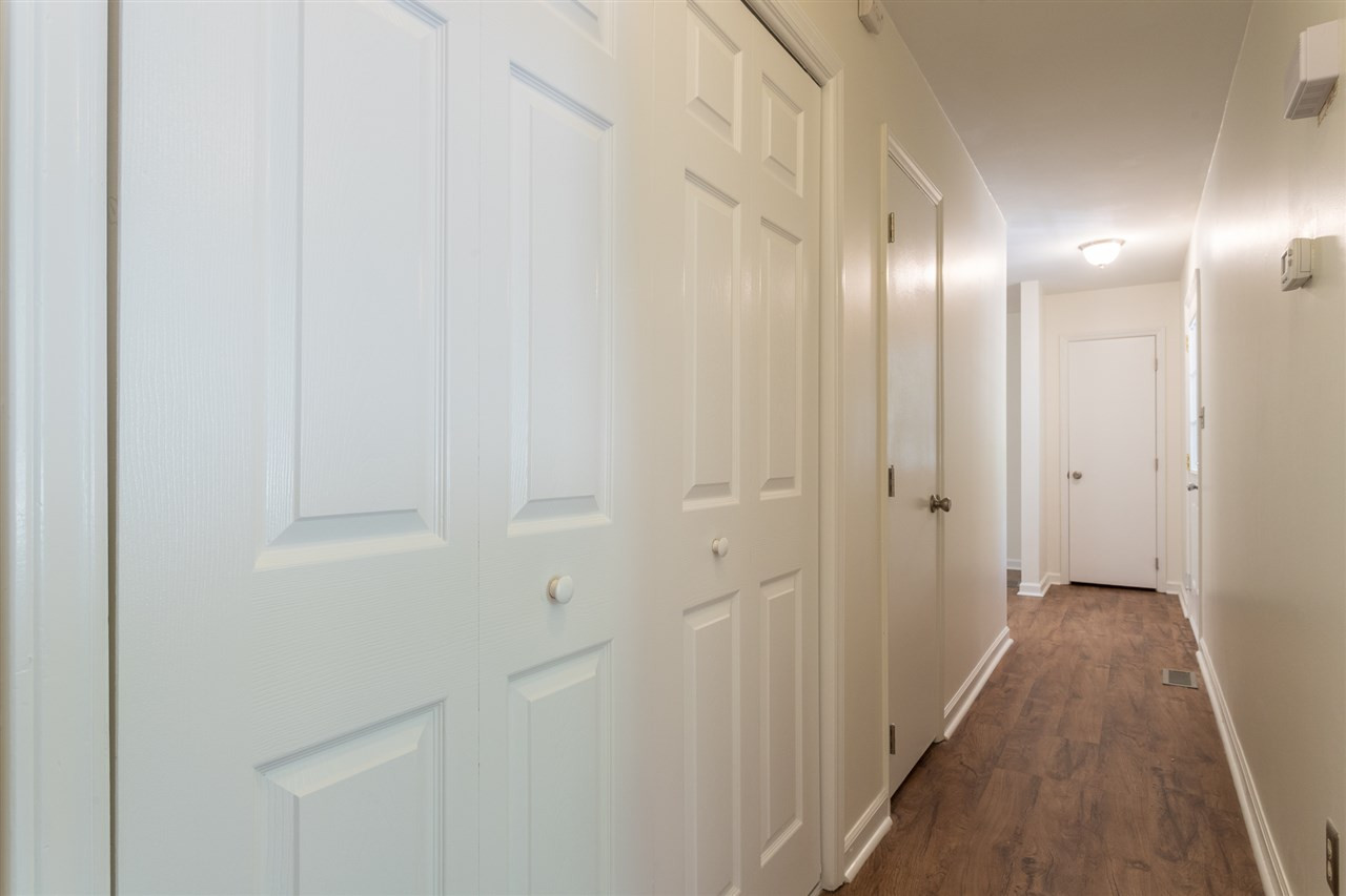 7405 Thorn Ridge Road Raleigh, NC 27613 - Photo 14 of 24 Hallway separate main living area from sleeping chambers. Hallway