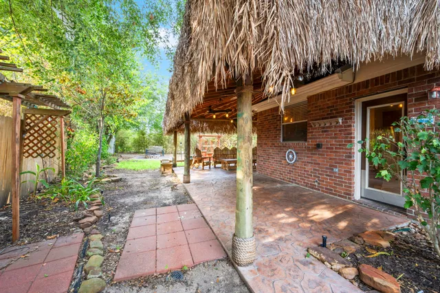 a view of a pathway of a house with a yard