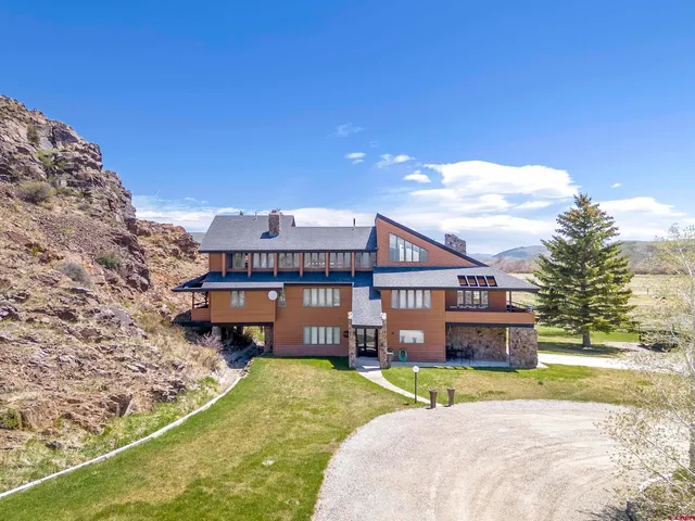 a view of a house with a big yard
