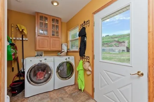 a kitchen with stainless steel appliances a refrigerator sink and cabinets