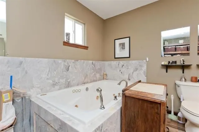 a utility room with washer and dryer