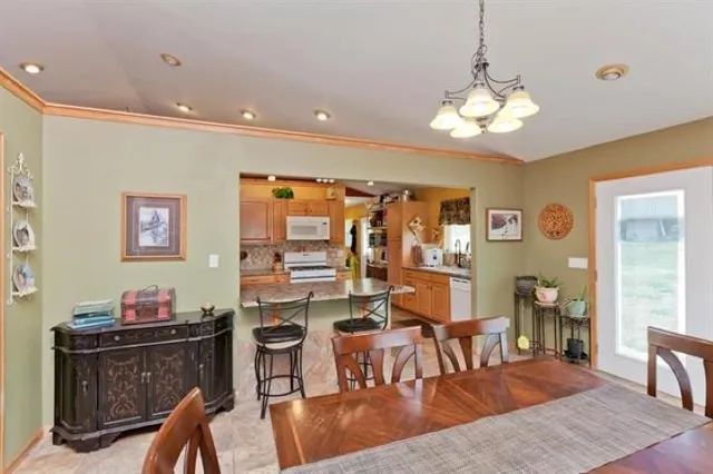 a view of a dining room with furniture window and outside view